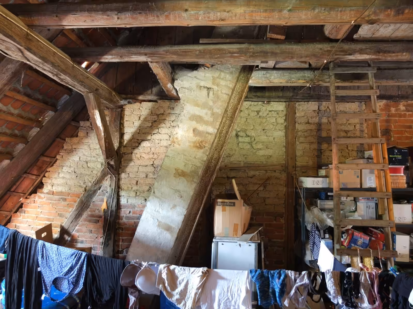 a loft with clothes hanging out to dry